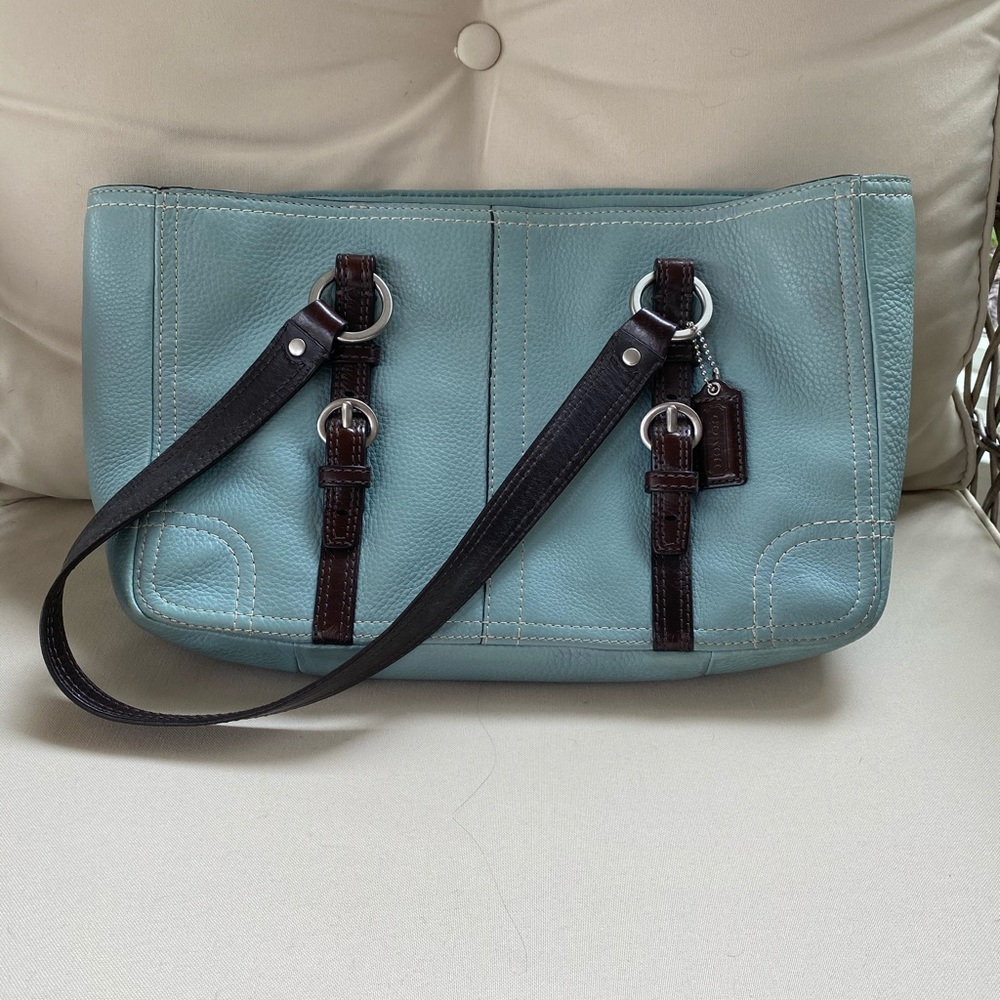 Gently used light turquoise Coach purse.